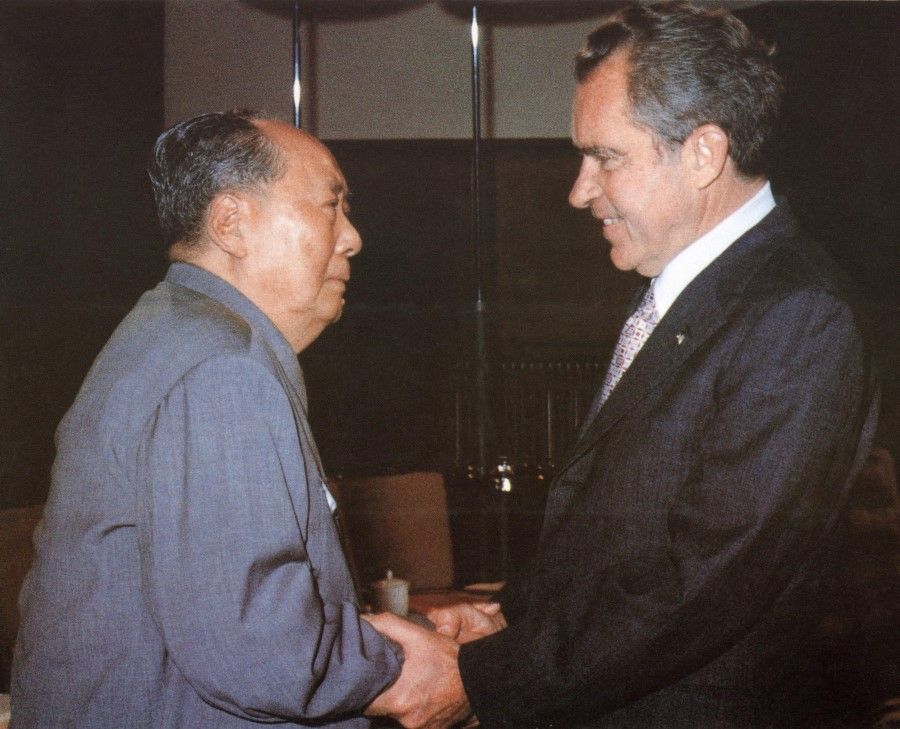 This file photo taken on 22 February 1972 shows China's Chairman Mao Zedong (left) welcoming US President Richard Nixon in Beijing during his visit to China. (Xinhua/AFP)