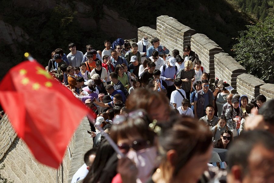Tourists visit the Badaling section of the Great Wall on the National Day holiday in Beijing, China, 1 October 2023. (Florence Lo/Reuters)