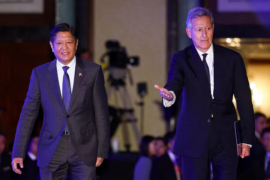 Philippines’ President Ferdinand Marcos Jr walks with John Chipman, Executive Chairman of the International Institute for Strategic Studies (IISS), at the Shangri-La Dialogue, in Singapore on 31 May 2024.  (Edgar Su/Reuters)