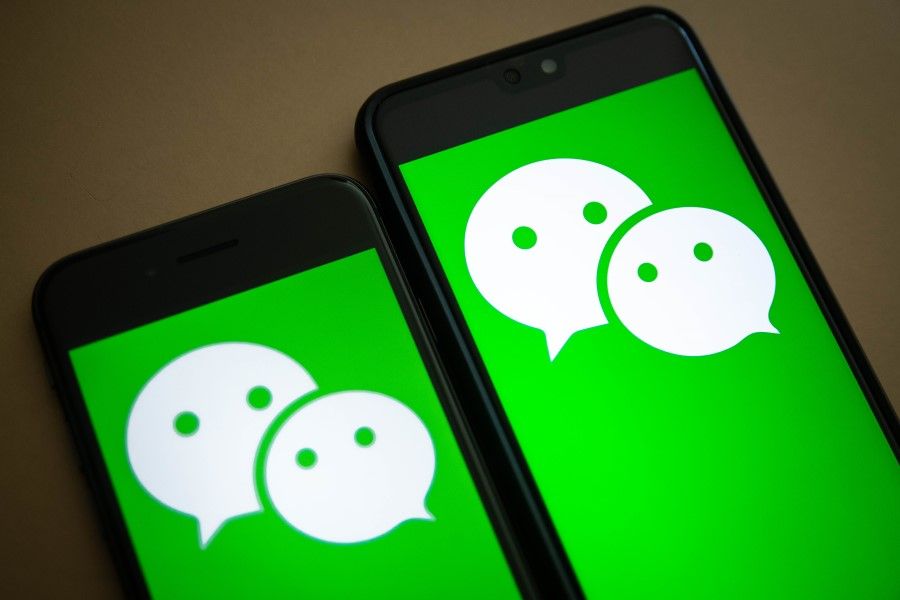 The logo for Tencent Holdings Ltd.'s WeChat app is arranged for a photograph on smartphones in Hong Kong, China, on Friday, Aug. 7, 2020. President Donald Trump signed a pair of executive orders prohibiting U.S. residents from doing business with the Chinese-owned TikTok and WeChat apps beginning 45 days from now, citing the national security risk of leaving Americans' personal data exposed. (Ivan Abreu/Bloomberg)