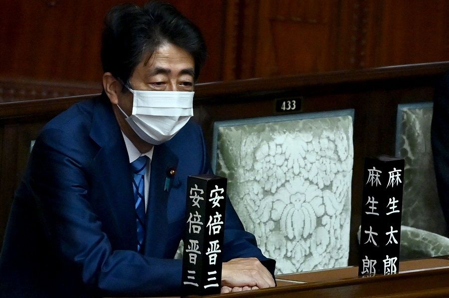 Japan's former prime minister Shinzo Abe attends the lower house plenary session of parliament to elect the prime minister of Japan, in Tokyo, on 10 November 2021. (Charly Triballeau/AFP)