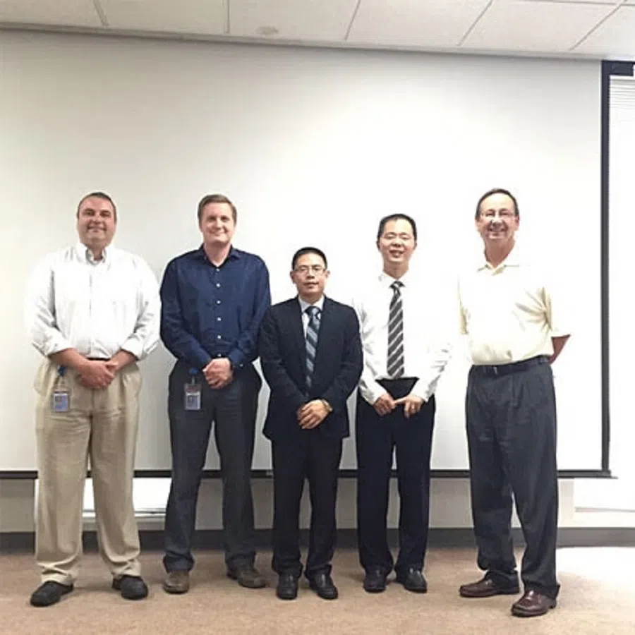 A shot of Cheng Yong (centre) during a trip to the US in 2015. (Official website of Changzhou Huali)