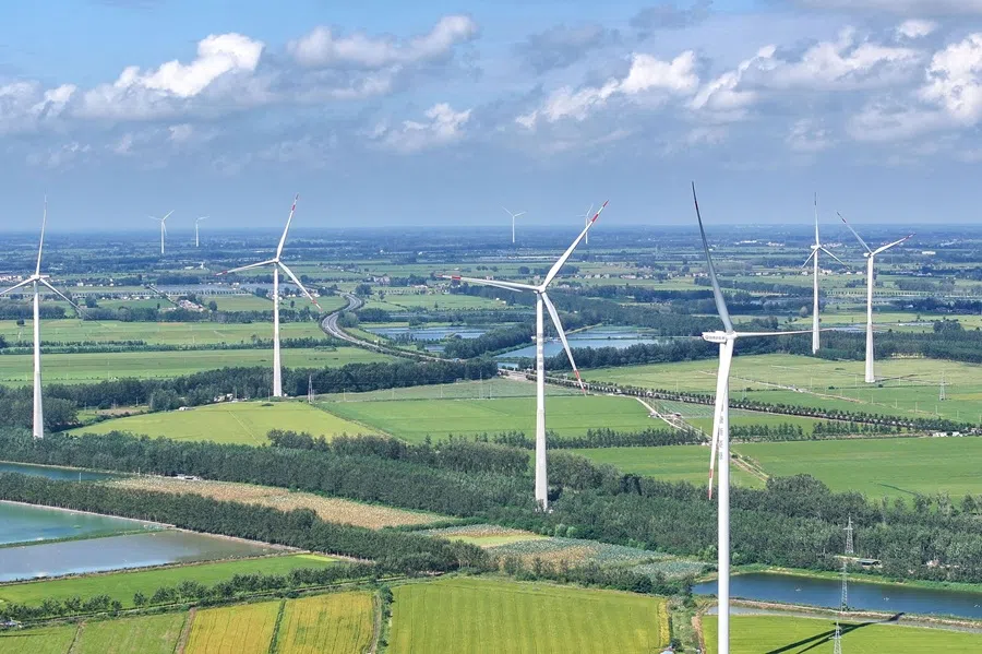 Wind turbines are pictured in Jinhu county, Huai'an city, Jiangsu province, China, on 22 September 2025.