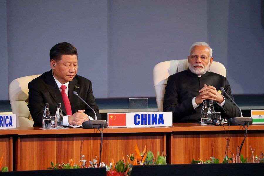 Indian Prime Minister Narendra Modi and Chinese President Xi Jinping attend a BRICS summit meeting in Johannesburg, South Africa, on 27 July 2018. (Mike Hutchings/File Photo/Reuters)