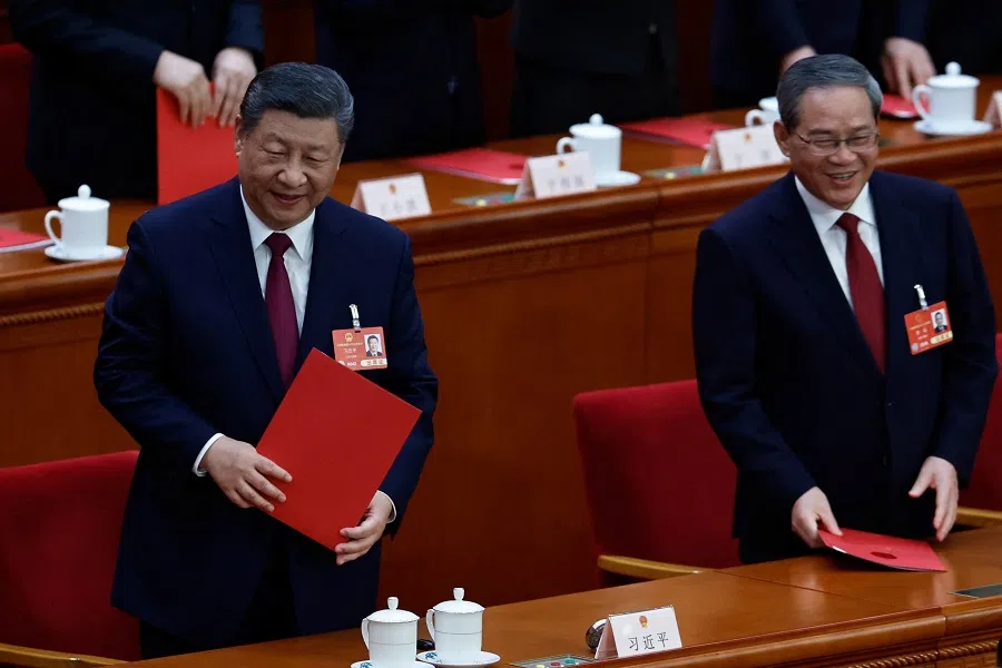 Chinese President Xi Jinping and Premier Li Qiang leave at the end of the closing session of the National People’s Congress (NPC) at the Great Hall of the People in Beijing, China on 11 March 2025. (Tingshu Wang/Reuters)