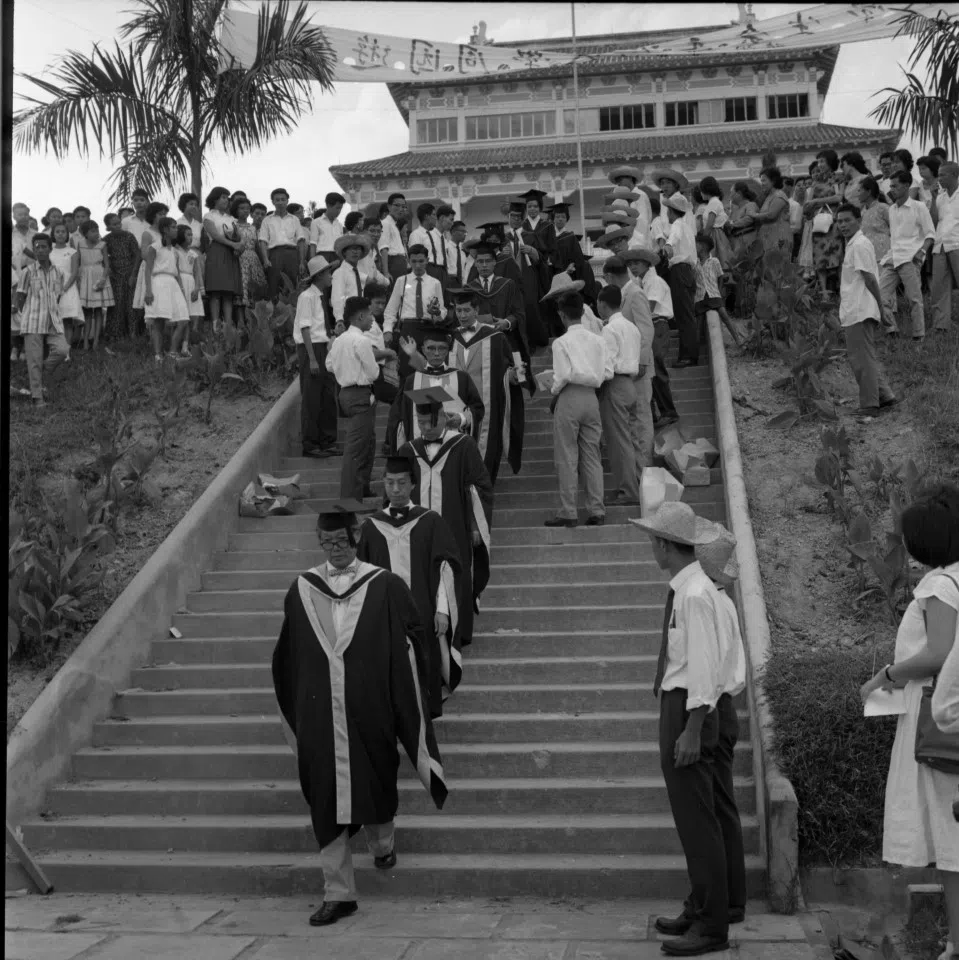 Graduates coming down the steps with today's Chinese Heritage Centre in the background during Nantah's first convocation. (SPH Media)