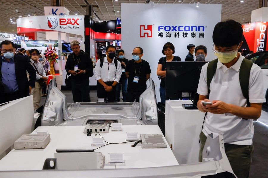 FoxConn is one of the major companies that has started to hire through livestreaming. This photograph shows people at the Foxconn booth at 2035 E-Mobility Taiwan, an annual electric and autonomous vehicle trade show in Taipei, Taiwan, 13 April 2023. (Ann Wang/Reuters)