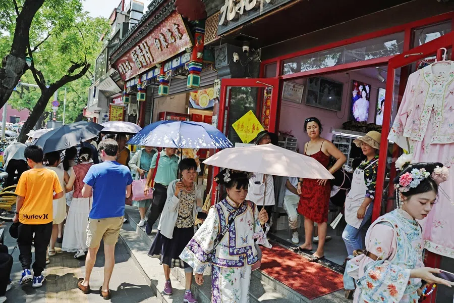 People walking at Wangfujing Pedestrian Street tourist attraction in Beijing, China, on 24 June 2025. (SPH Media)