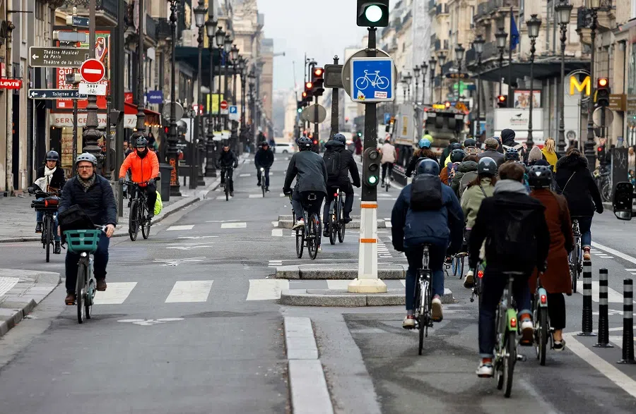 Bikers ride on a bicycle path at Rivoli Street, in Paris, France on 23 February 2023. (Ludovic Marin/AFP)