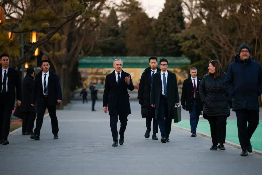 Canada’s Prime Minister Mark Carney walks at Ritan Park, during the first visit by a Canadian prime minister to China since 2017, in Beijing, China, 16 January 2026. (Carlos Osorio/Reuters)