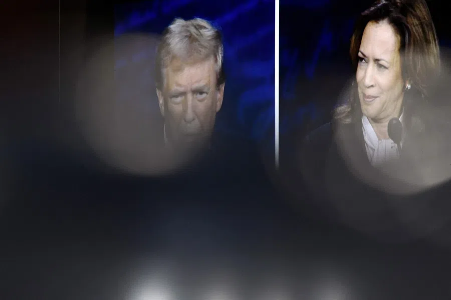 US Vice-President and Democratic presidential candidate Kamala Harris and former US President and Republican presidential candidate Donald Trump are seen on a screen as they participate in a presidential debate at the National Constitution Center in Philadelphia, Pennsylvania, on 10 September 2024.