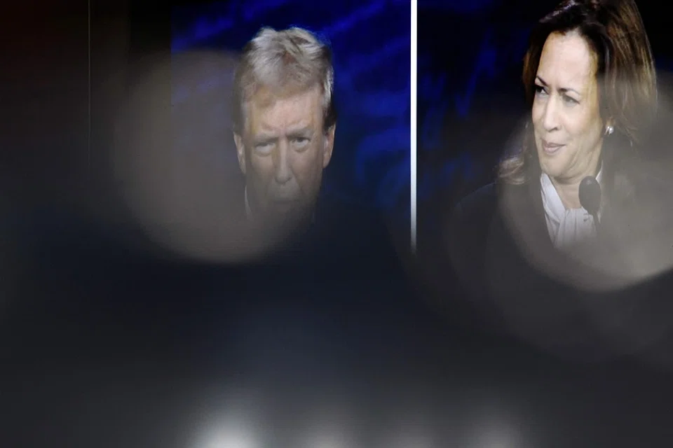 US Vice-President and Democratic presidential candidate Kamala Harris and former US President and Republican presidential candidate Donald Trump are seen on a screen as they participate in a presidential debate at the National Constitution Center in Philadelphia, Pennsylvania, on 10 September 2024. (Matthew Hatcher/AFP)