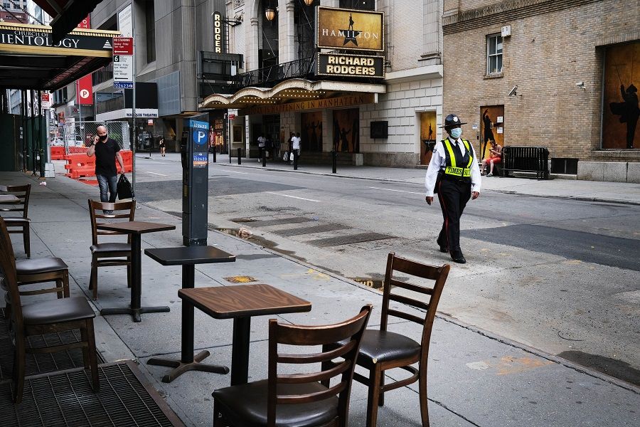 Broadway theaters stand closed along an empty street in the theater district on 30 June 2020 in New York City. (Spencer Platt/Getty Images/AFP)