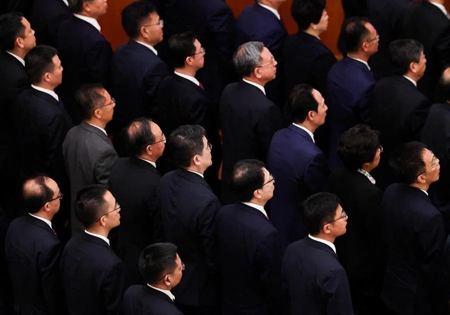 Chinese Communist Party (CCP) members stand as they listen to "The Internationale" music during a ceremony marking the 105th anniversary of the founding of the Communist Party of China at the Great Hall of the People in Beijing, China, on 1 July 2026.