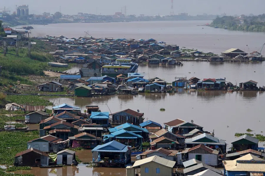 Floating houses sit on the Tonle Sap River near Phnom Penh, Cambodia, 20 February 2021. (Cindy Liu/Reuters)