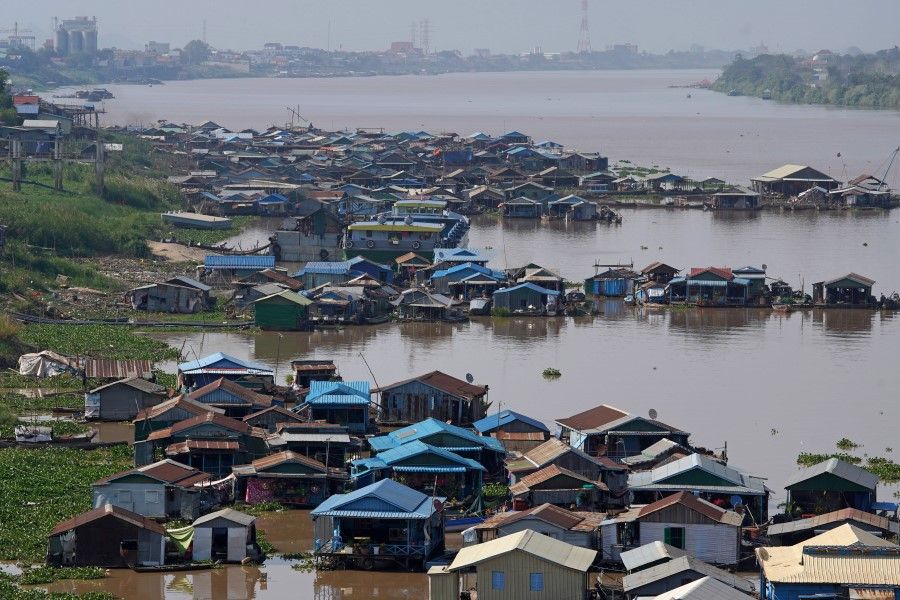 Floating houses sit on the Tonle Sap River near Phnom Penh, Cambodia, 20 February 2021. (Cindy Liu/Reuters)