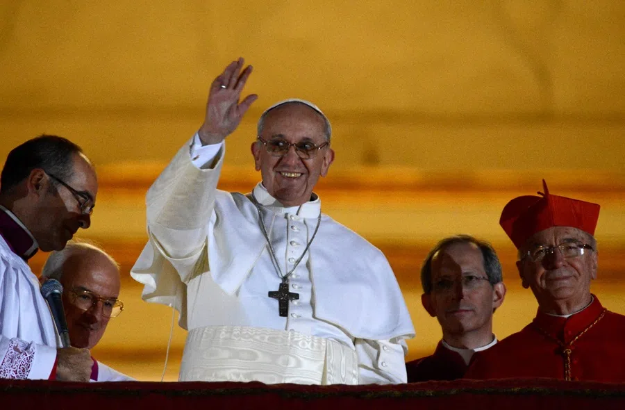 Newly elected Pope Francis, Cardinal Jorge Mario Bergoglio of Argentina appears on the balcony of St. Peter's Basilica after being elected by the conclave of cardinals, at the Vatican, 13 March 2013. (Dylan Martinez/Reuters)
