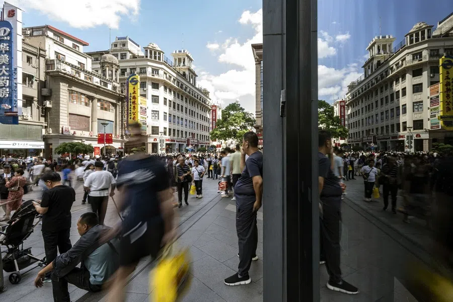 Shoppers on Nanjing East Road in Shanghai, China, 2 October 2024.