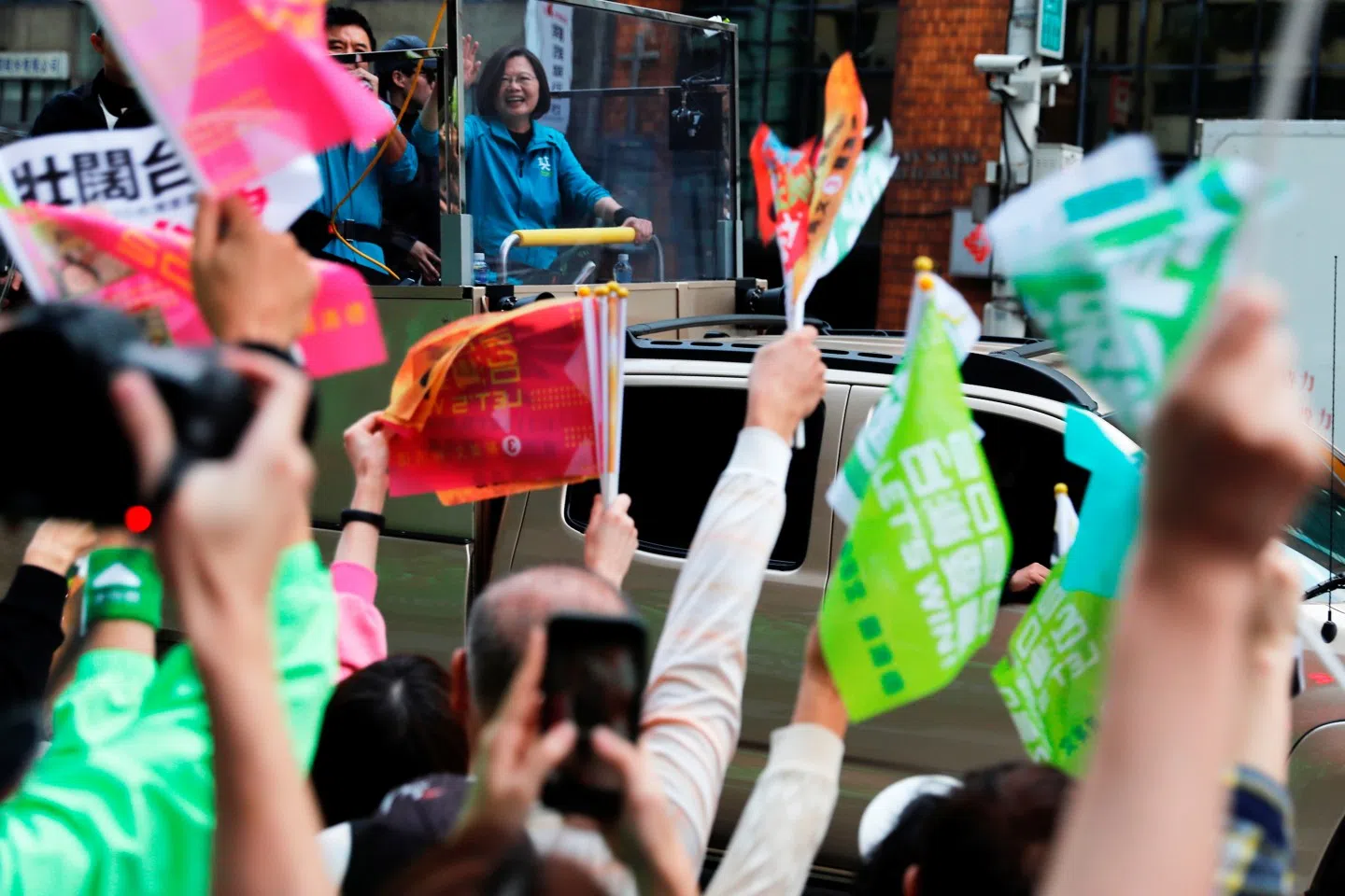 The "I am from Taiwan" sticker and badge craze may be a result of nationalistic sentiments following the presidential elections that were just over. In this photo, Taiwan President Tsai Ing-wen waves to supporters from a vehicle during a campaign event in Taipei on 10 January 2020. (Tyrone Siu/Reuters)