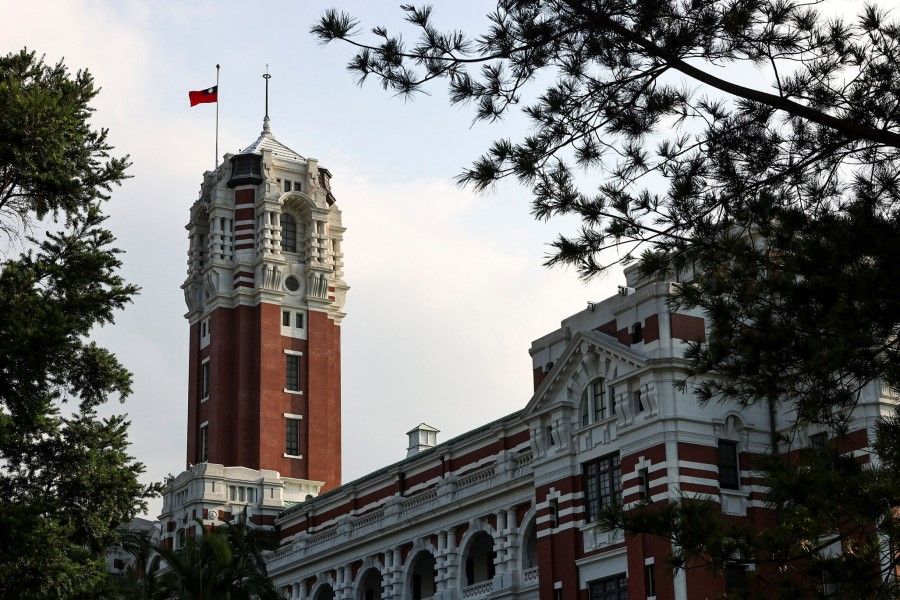 The Taiwanese flag flies at half-mast at the Presidential building to pay tribute to the late former Japanese Prime Minister Shinzo Abe, who was shot while campaigning for a parliamentary election, in Taipei, Taiwan, 11 July 2022. (Ann Wang/Reuters)