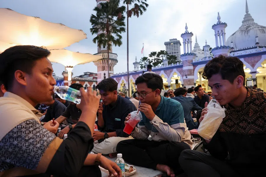 Muslims break their fast during the holy month of Ramadan in Kuala Lumpur, Malaysia, on 14 March 2024. (Hasnoor Hussain/Reuters)