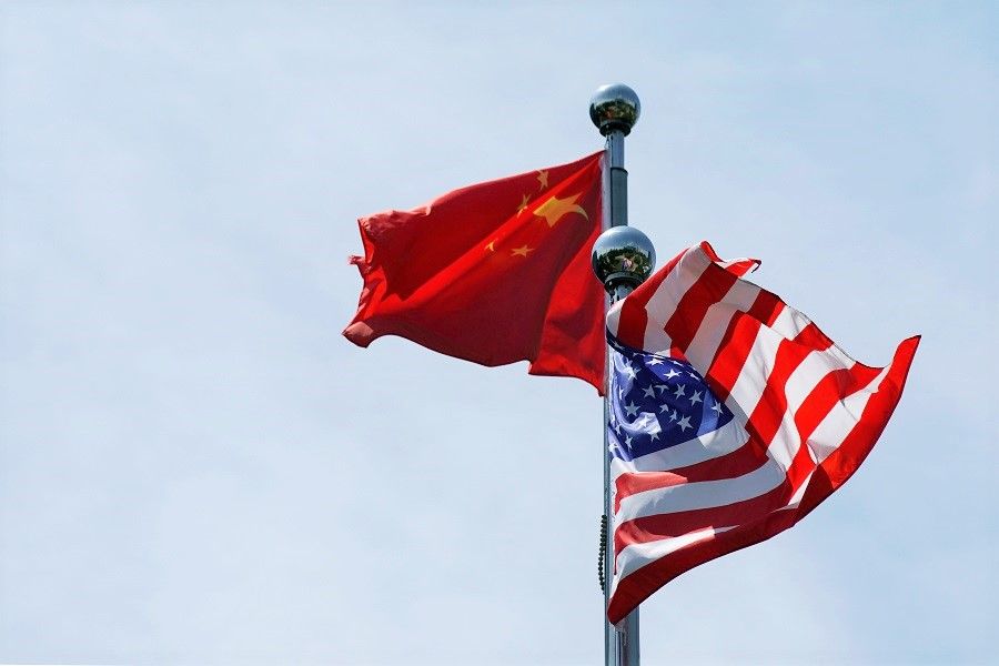 Chinese and US flags flutter before a trade meeting in Shanghai, China, 30 July 2019. (Aly Song/File Photo/Reuters)