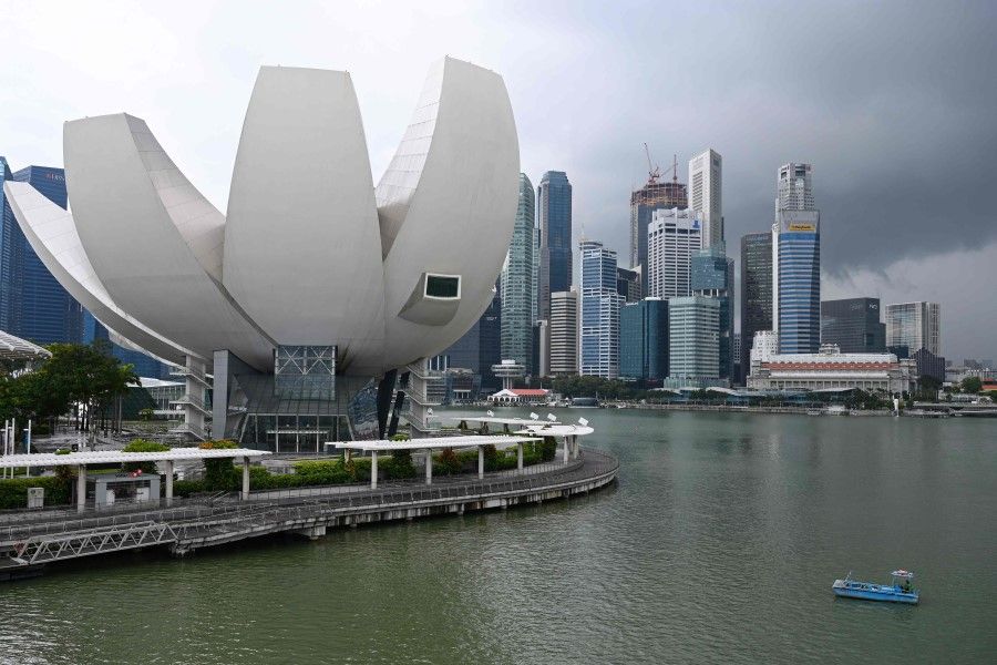 A general view shows the ArtScience Museum (left) against the backdrop of the city skyline in Singapore on 28 January 2021. (Roslan Rahman/AFP)