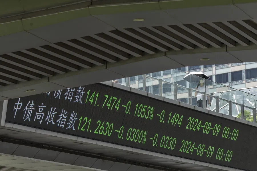 An electronic ticker displays stock figures in Pudong’s Lujiazui Financial District in Shanghai, China, on 14 August 2024.