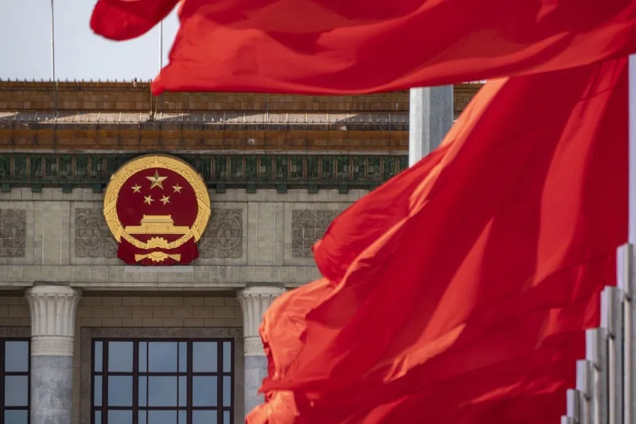 The Chinese national emblem and flags at the Great Hall of the People in Beijing, China, on 18 October 2023. (Qilai Shen/Bloomberg)