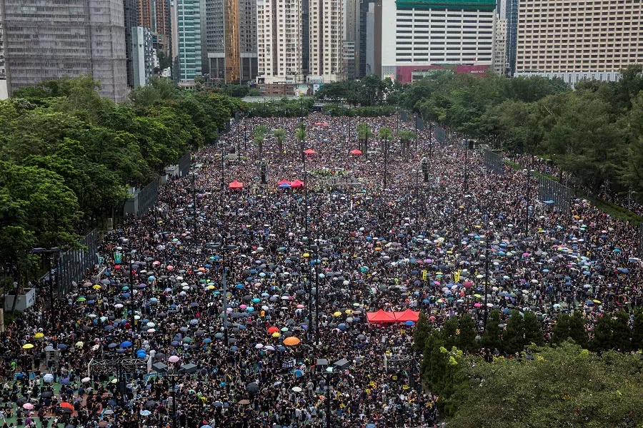 In this file photo taken on 18 August 2019, protesters gather for a rally in Victoria Park in Hong Kong, in opposition to a planned extradition law that had morphed into a wider call for democratic rights in the semi-autonomous city. (Isaac Lawrence/AFP)