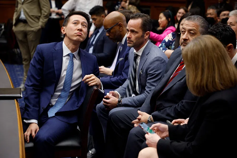 TikTok CEO Shou Zi Chew (left) talks with his company's vice-president for public policy Michael Beckerman (centre) during a break in Chew's testimony before the House Energy and Commerce Committee on Capitol Hill on 23 March 2023 in Washington, DC, US. (Chip Somodevilla/Getty Images/AFP)