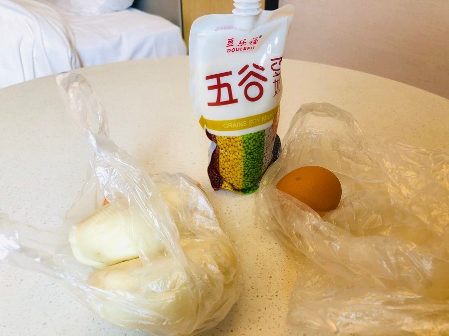 Breakfast during quarantine: milk, egg, and buns.