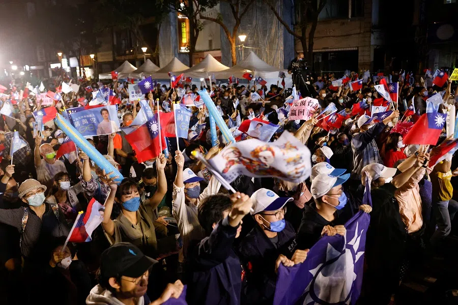 Supporters of Kuomintang (KMT) celebrate the preliminary results of the local elections during a rally in Taipei, Taiwan, 26 November 2022. (Carlos Garcia Rawlins/Reuters)