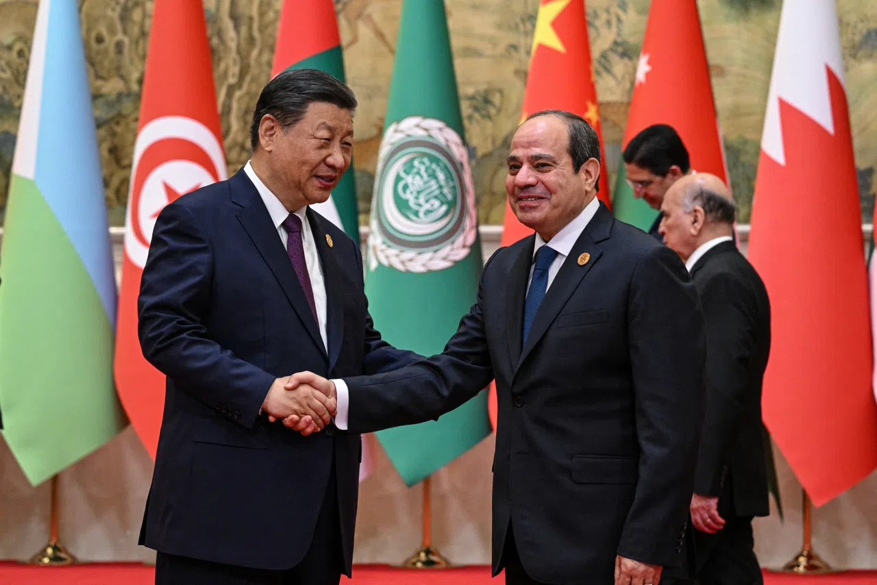 China’s President Xi Jinping shakes hands with Egypt’s President Abdel Fattah al-Sisi ahead of the opening ceremony of the 10th Ministerial Meeting of China-Arab States Cooperation Forum at the Diaoyutai State Guesthouse in Beijing, China, 30 May 2024. (Jade Gao/Pool via Reuters)
