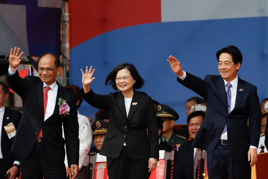 Taiwan President Tsai Ing-wen waves next to Taiwan Vice-President William Lai and Taiwan Parliament Speaker You Si-kun, during the Double Tenth Day celebration ceremony in Taipei, Taiwan, on 10 October 2023. (Carlos Garcia Rawlins/Reuters)