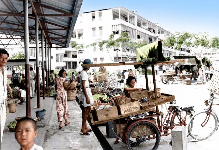 A hawker beside a market, 1960s. At the time, mobile hawkers were everywhere, and a means for ordinary people to make a living.