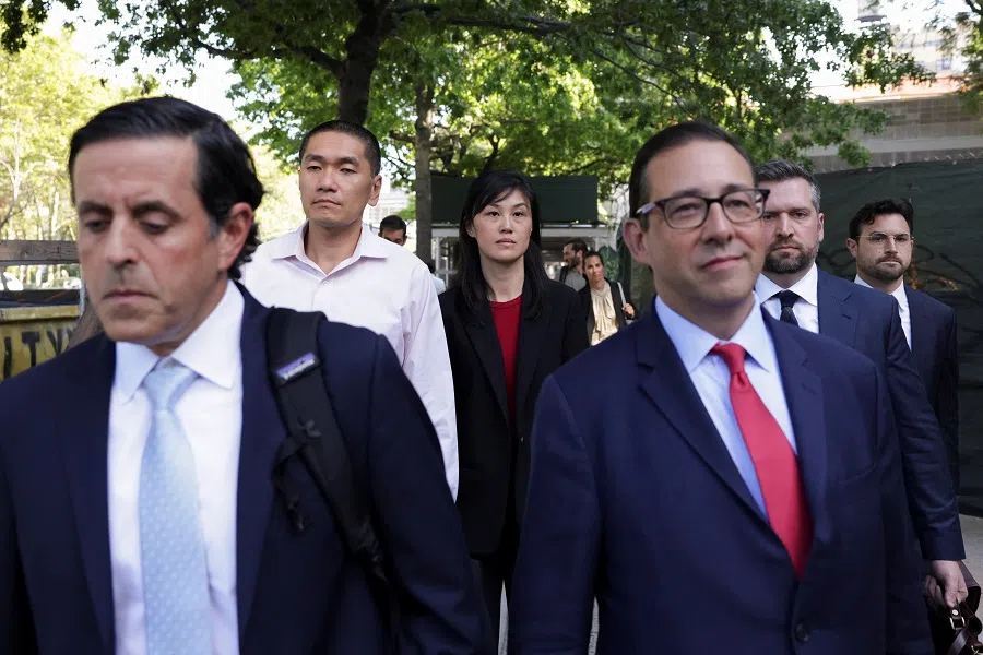 Linda Sun exits Brooklyn Federal court with her husband Chris Hu and her lawyers after Sun was charged with acting as an unregistered agent of China’s government in New York City, US on 3 September 2024. (Kent J. Edwards/Reuters)