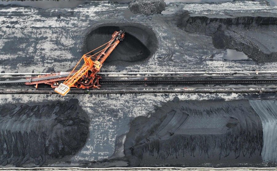 This aerial photo taken on 21 July 2022 shows a bucket wheel machine transferring coal at a coal storage centre in Jiujiang, in China's central Jiangxi province. (AFP)