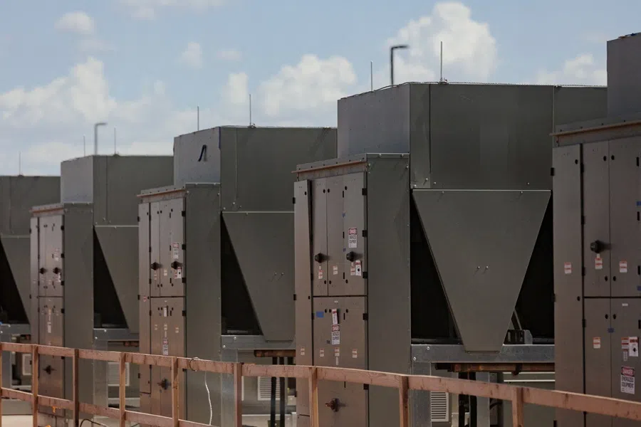 Chillers that cool water are connected to a data centre building during a tour of the OpenAI data center in Abilene, Texas, US, on 23 September 2025.