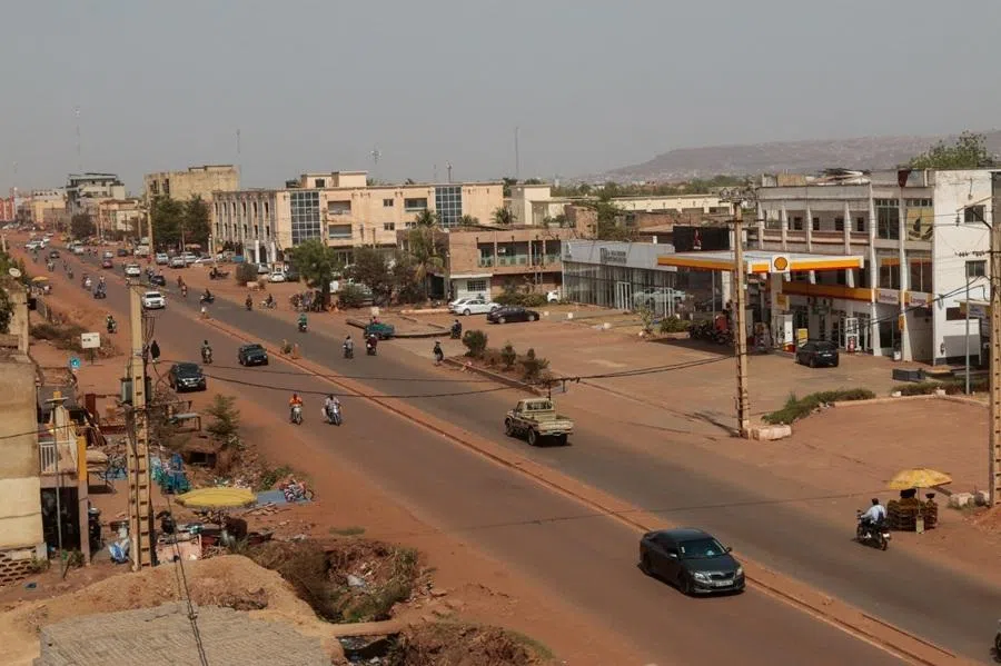 People move on a street after insurgents launched attacks on military bases across the country, in Bamako, Mali, 25 April 2026.