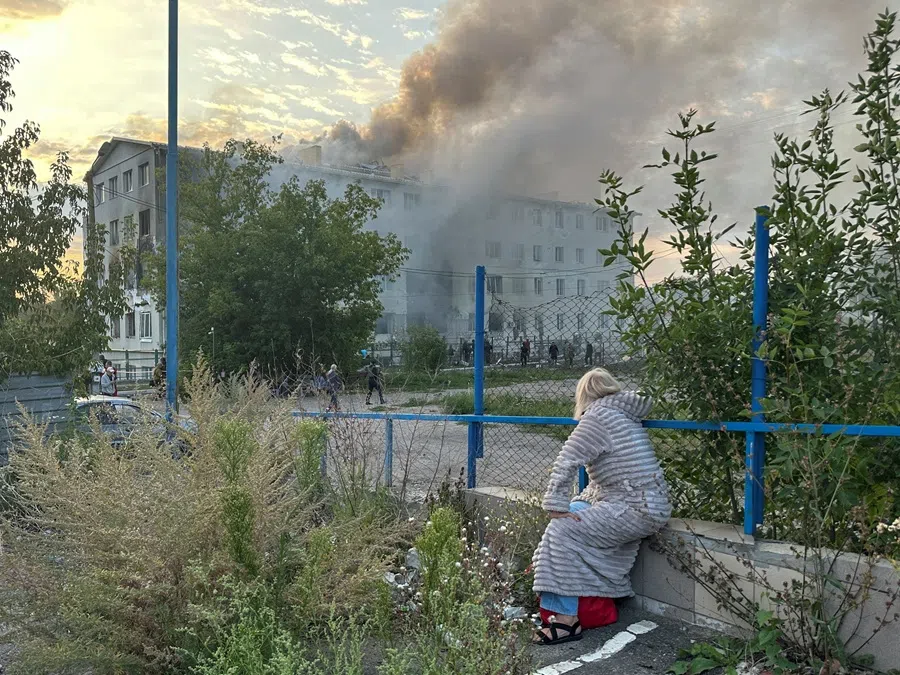 A resident gazes at an apartment building hit by a Russian drone strike, amid Russia’s attack on Ukraine, in Kharkiv, Ukraine, on 18 August 2025. (Sofila Gatilova/Reuters)