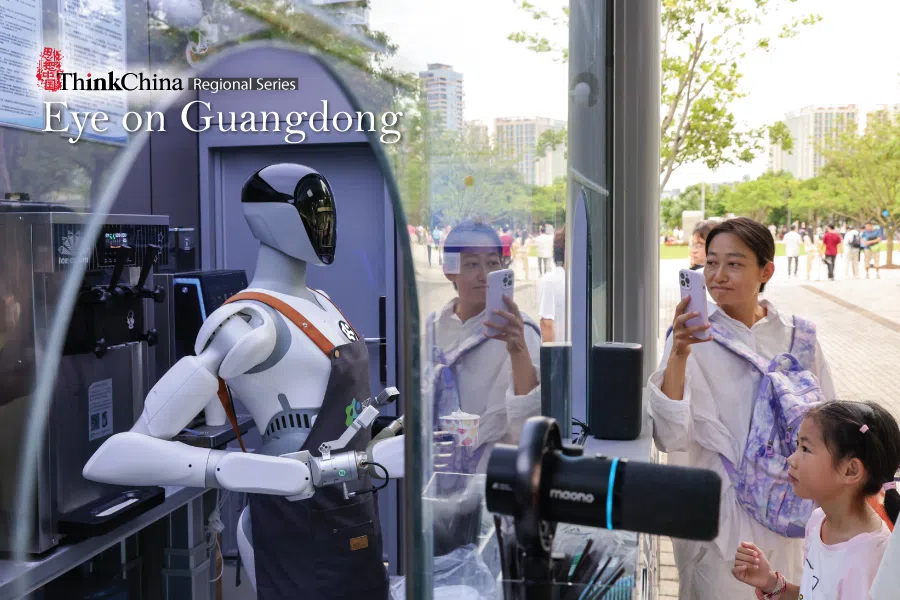 A robot staff member serves ice cream to visitors at Shenzhen Talent Park in Shenzhen, China, on 3 August 2026.