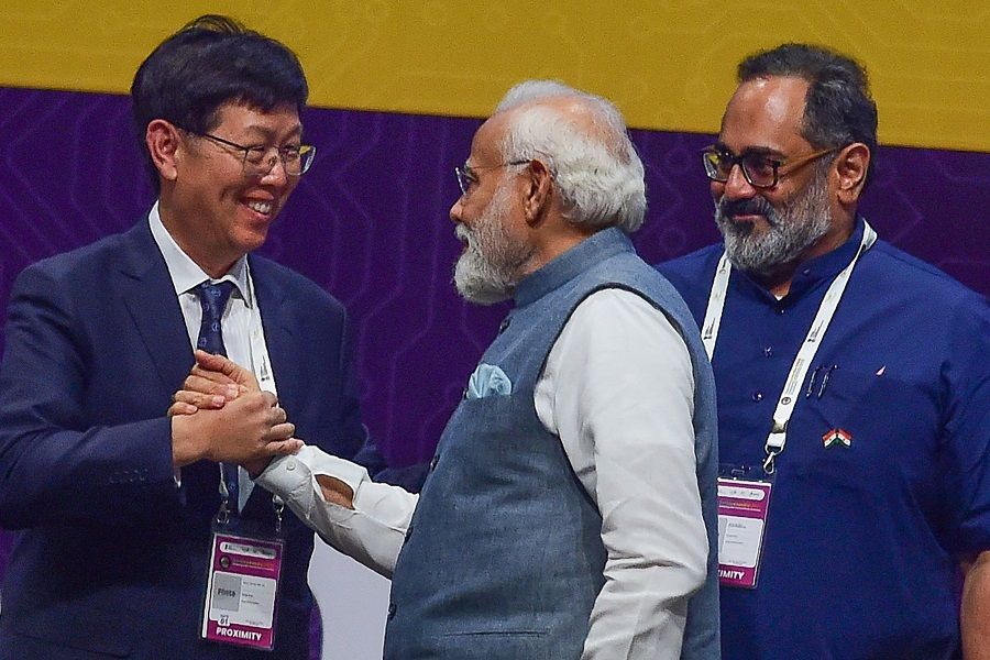 Foxconn Chairman and CEO Young Liu (left) greets Indian Prime Minister Narendra Modi (centre), during Semicon India 2023, at Mahatma Mandir in Gandhinagar, India, on 28 July 2023. (Sam Panthaky/AFP)