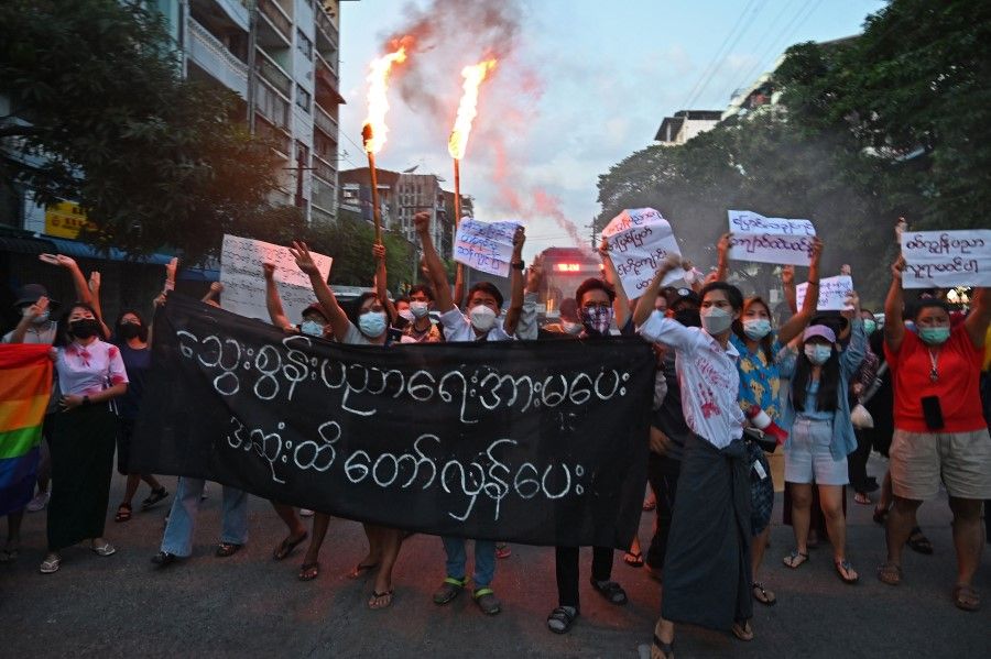 Protesters take part in a demonstration against the military coup in Yangon on 10 November 2021. (AFP)
