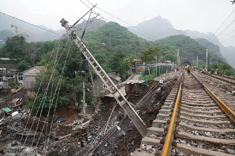 A railway is damaged by flood at Miaofengshan town in Mentougou district, Beijing, on 1 August 2023.