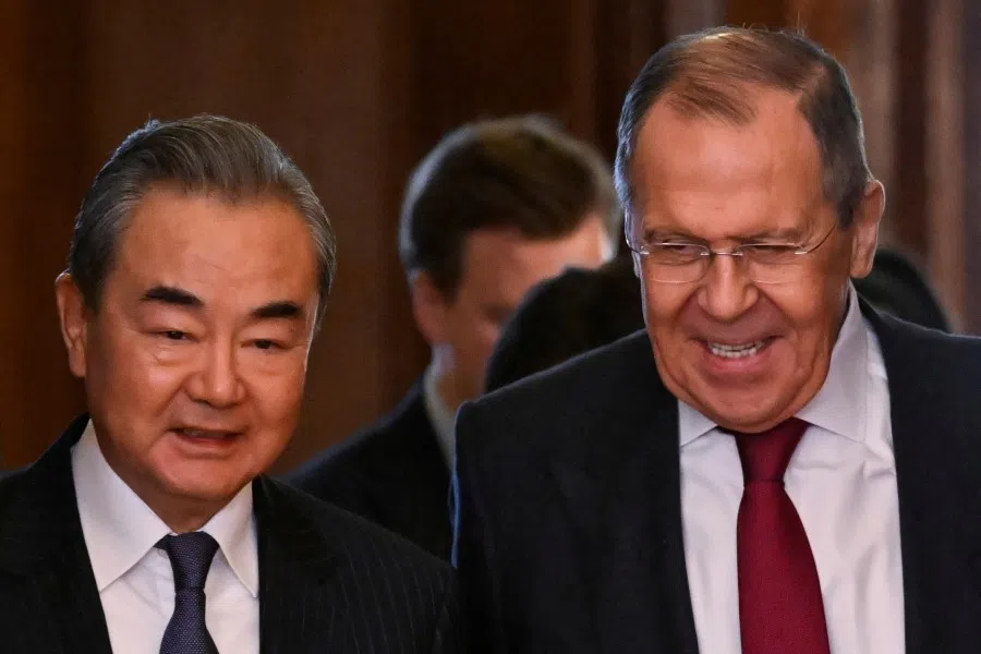 Russia’s Foreign Minister Sergey Lavrov and China’s Director of the Office of the Central Foreign Affairs Commission Wang Yi enter a hall during a meeting in Moscow, Russia, 22 February 2023. (Alexander Nemenov/Pool via Reuters)