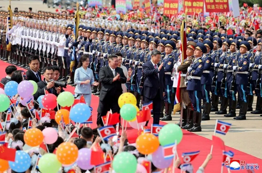 This picture taken on 9 June 2026 and released by North Korea’s official Korean Central News Agency (KCNA) on 10 June 2026 shows North Korean leader Kim Jong Un (centre left) and his wife Ri Sol Ju (left) seeing off China’s President Xi Jinping (centre right) and his wife Peng Liyuan during the latter’s departure from Pyongyang International Airport. (KCNA via KNS/AFP)