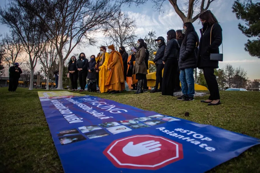 People gather for a candlelight vigil in Garden Grove, California, on 17 March 2021 to unite against the recent spate of violence targeting Asians. (Apu Gomes/AFP)