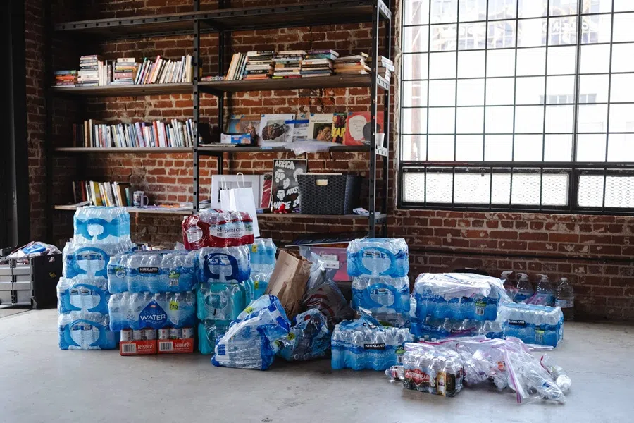 Cases of bottled water sit at a supply pick up station for people planning on attending protests on 11 June 2025 in Los Angeles, California.