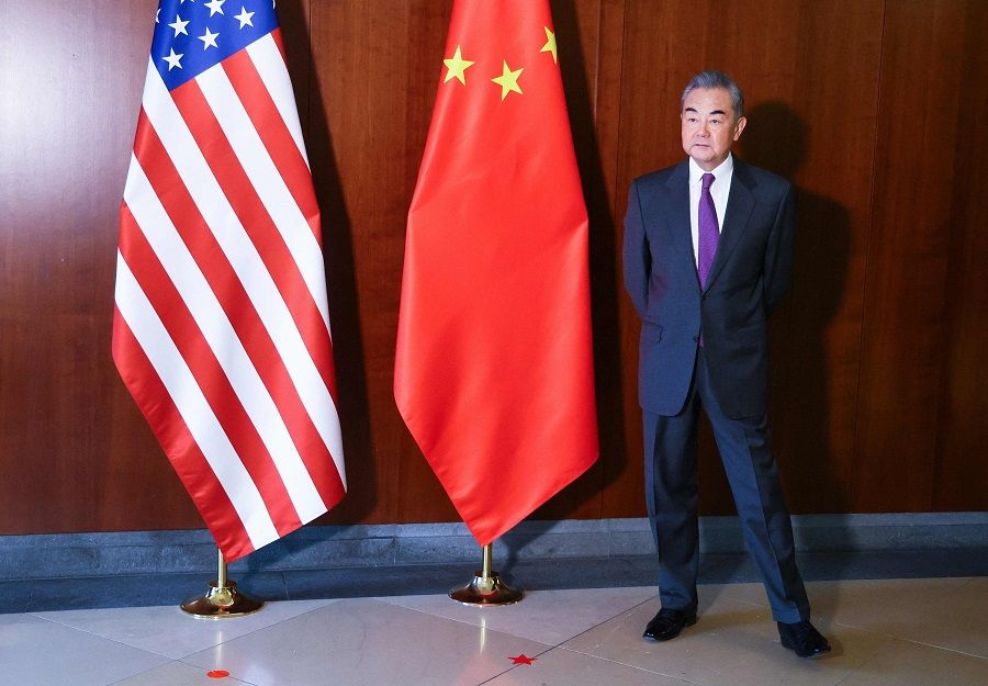 Chinese Foreign Minister Wang Yi waits for the US secretary of state at the 60th Munich Security Conference at the Bayerischer Hof Hotel in Munich, Germany, on 16 February 2024. (Wolfgang Rattay/Pool/AFP)